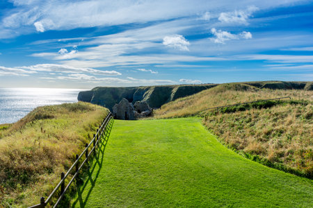 Donnottarr Castle in Scotland on the North Sea coast, beautiful landscapeの写真素材