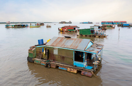 Village on the water of Tonle Sap lake in Cambodia. Beautiful lighting, sunset.の写真素材
