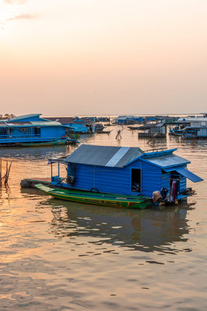 Village on the water of Tonle Sap lake in Cambodia. Beautiful lighting, sunset.の写真素材
