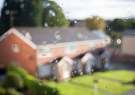 A flat with window and water drops on the windows House on the mortgage concept HD Monochromatic...