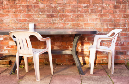 White modern chair on brick wall background