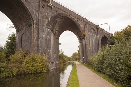 Old train bridge made of red bricks masonry above the kanal in Wolverhamptoinの写真素材