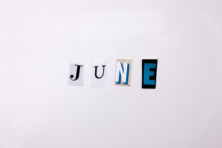 A word writing text showing concept of JUNE made of different magazine newspaper letter for Business case on the white background with spaceの写真素材