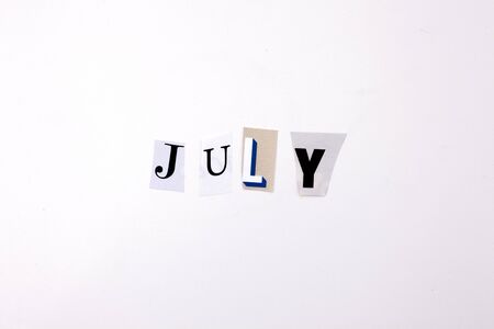 A word writing text showing concept of JULY made of different magazine newspaper letter for Business case on the white background with spaceの写真素材