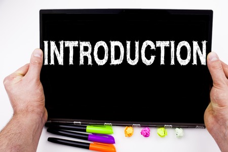 Introduction text written on tablet, computer in the office with marker, pen, stationery.の写真素材