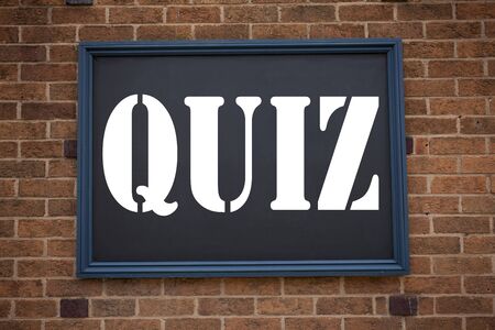 Conceptual hand writing text caption inspiration showing announcement Quiz. Business concept for Test education Exam Concept written on frame old brick background with spaceの写真素材