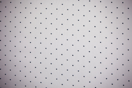 Dotted, spotted background on the piece of fabric with copy text. Polka dot style with bedotted dots.の写真素材