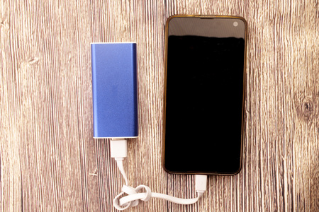 White sticky note with empty space for text wooden backgroundの写真素材