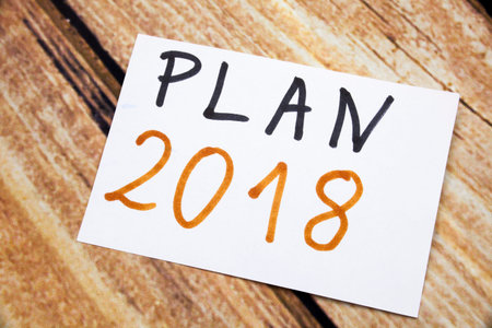 The words Plan 2018 written on a sticky note