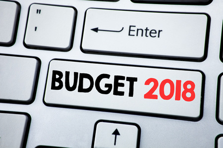 Writing text showing Budget 2018. Business concept for Household budgeting accounting planning written on white keyboard key with copy space. Top viewの写真素材