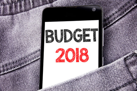 Hand writing text caption inspiration showing Budget 2018. Business concept for Household budgeting...