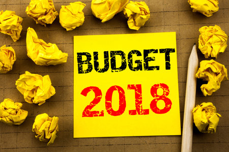 Handwriting text showing Budget 2018. Business concept for Household budgeting accounting planning...