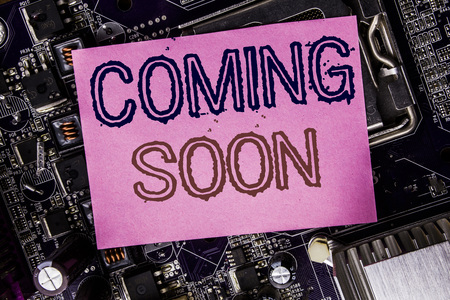 Conceptual hand writing text caption inspiration showing Coming Soon. Business concept for Message Future Written on sticky, computer main board background.の写真素材