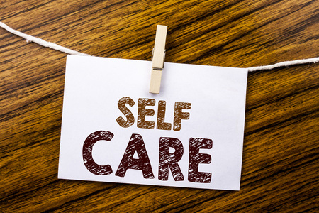 Handwriting Announcement text showing Self Care. Business concept for Taking caring for own Health written on sticky note paper on wooden background.の写真素材