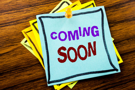 Writing text showing Coming Soon. Business concept for Under Construction written on sticky note...
