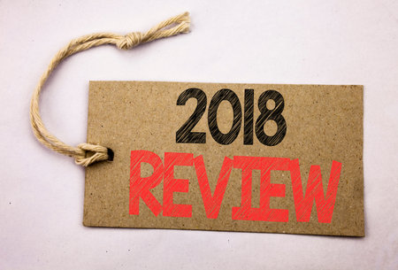 Hand writing text caption inspiration showing 2018 Review. Business concept for Feedback On Progress...