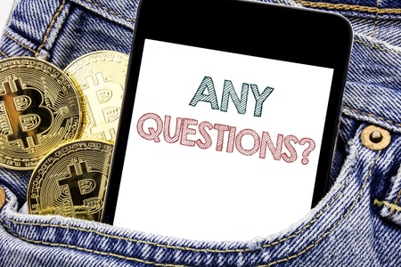 Hand writing text caption inspiration showing Any Questions. Business concept for Answer Help Question Written phone mobile phone, cellphone placed in man front jeans pocket.の写真素材