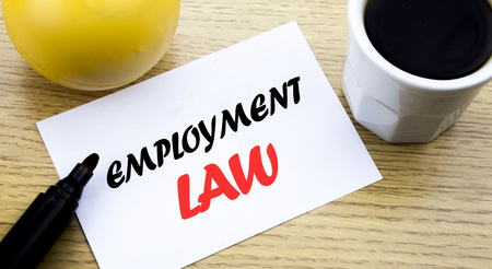 Conceptual hand writing text showing Employment Law. Business concept for Employee Legal Justice written sticky note paper, Wooden background with copy space, Coffee and markerの写真素材