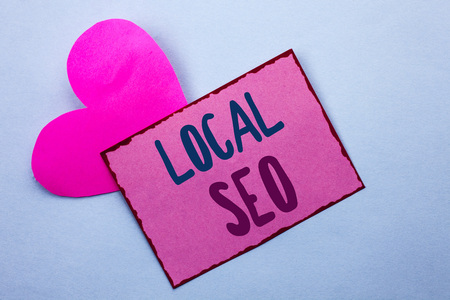 Writing note showing  Local Seo. Business photo showcasing Search Engine Optimization Strategy Optimize Local Find Keywords written Pink Sticky Note Paper the Plain background with Heart.の写真素材