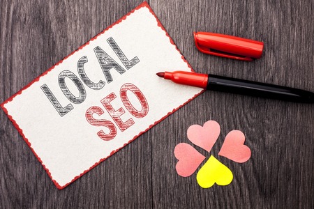 Conceptual hand writing showing Local Seo. Business photo text Search Engine Optimization Strategy Optimize Local Find Keywords written Cardboard Piece With Marker wooden background Hearts.の写真素材