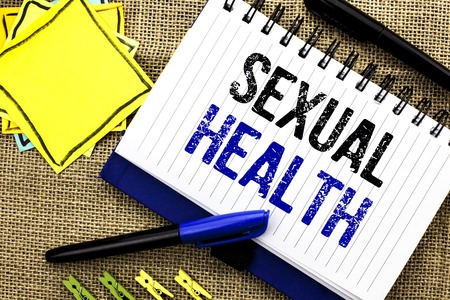 Conceptual hand writing showing Sexual Health. Business photo showcasing STD prevention Use Protection Healthy Habits Sex Care written Notebook Book the jute background Clips and Pensの写真素材