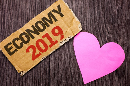Handwriting text Economy 2019. Concept meaning Financial Currency Growth Market Earnings Trade Money...
