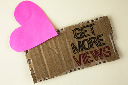 Handwriting text Get More Views. Concept meaning Increase web traffic optimise blog strategy analyse digitally written Tear Cardboard Piece on the plain background Heart next to it.の写真素材