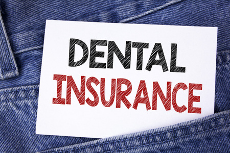 Text sign showing Dental Insurance. Conceptual photo Dentist healthcare provision coverage plans claims benefit written Sticky Note Paper the Jeans background.の写真素材