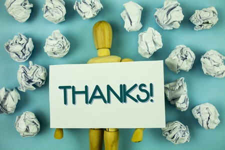 Writing note showing  Thanks Motivational Call. Business photo showcasing Appreciation greeting Acknowledgment Gratitude written Sticky Note paper plain background Toy Paper Balls.の写真素材