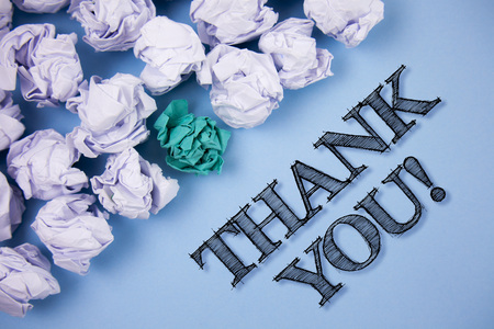 Text sign showing Thank You Motivational Call. Conceptual photo Appreciation greeting Acknowledgment Gratitude written the Plain Blue background Paper Balls next to it.の写真素材