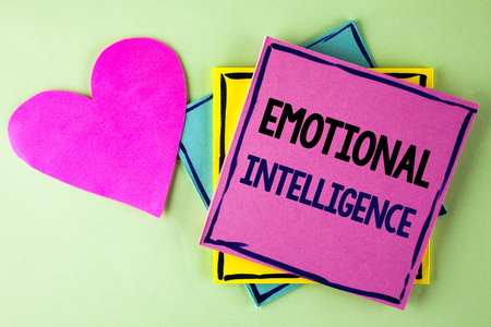 Writing note showing  Emotional Intelligence. Business photo showcasing Capacity to control and be aware of personal emotions written Pink Sticky Note Paper plain background Heart next to it.の写真素材