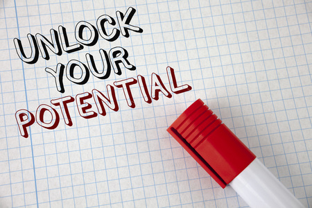 Handwriting text Unlock Your Potential. Concept meaning Reveal talent Develop abilities Show personal skills written Notebook Paper Marker next to it. Top view.の写真素材