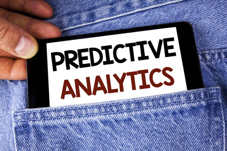 Conceptual hand writing showing Predictive Analytics. Business photo text Method to forecast Performance Statistical Analysis written Mobile phone holding by man the Jeans background.の写真素材
