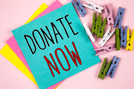 Conceptual hand writing showing Donate Now. Business photo showcasing Give something to charity Be an organ donor Help othersの写真素材