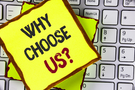 Text sign showing Why Choose Us Question. Conceptual photo Reasons to select our Services Products or Offers written Sticky Note Paper placed the Laptop.の写真素材