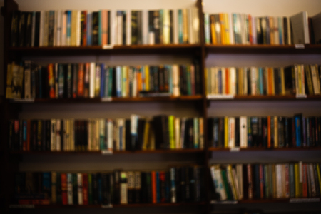 A large interior room home library with many diffirent books. Front view to wooden shelf filled with large number of books, bookshelves concept imageの写真素材