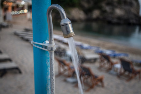 Water flowing through a tap and it is clamped as well as trapped in a beach resort. There it is...