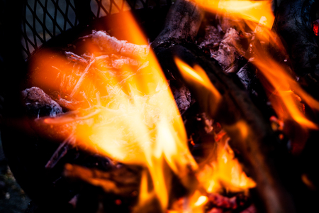 Blurred fire flames in abstract image. Extreme closeup of open fire flames. Barbecue fire preparing in the outdoors.  Burning wood in extreme closeup viewの写真素材