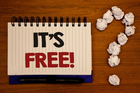Text sign showing It Is Free Motivational Call. Conceptual photo Product can be purchased at no monetary costIdeas on notebook wooden background quotation mark made of crumpled papersの写真素材