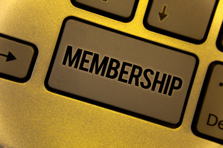Conceptual hand writing showing Membership. Business photo showcasing Being member Part of a group or team Join an organizationYellow Keyboard brown key Intention create texts on computerの写真素材