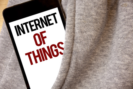 Handwriting text writing Internet Of Things. Concept meaning Innovation Globalization Digital Electronics Connectivity Hoar frost color side pocket cell phone be visible black and red lettersの写真素材