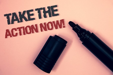 Text sign showing Take The Action Now Motivational Call. Conceptual photo Act Start Promptly Immediate Instantly Pinkish platform black and red message one corner open black markerの写真素材