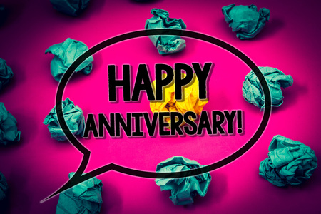 Handwriting text Happy Anniversary Motivational Call. Concept meaning Annual Special Milestone Commemoration Huge emerald paper lobs surroundes yellow paper ball magenta color floorの写真素材