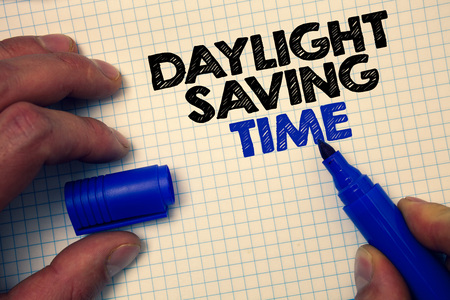Text sign showing Daylight Sayving Time. Conceptual photo advancing clocks during summer to save electricity Graph paper grey important thoughts ideas information science math dataの写真素材