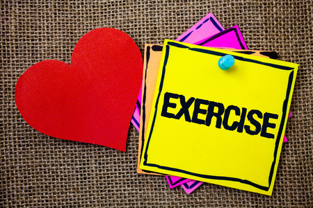Writing note showing  Exercise. Business photo showcasing Activity requiring physical effort Bringing into play Training Ideas messages paper papers red heart love message jute backgroundの写真素材