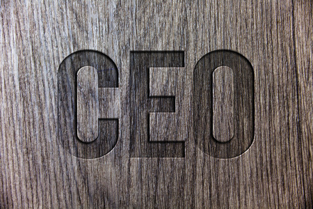 Conceptual hand writing showing Ceo. Business photo showcasing Chief Executive Officer Head Boss Chairperson Chairman Controller Wooden background vintage wood board message ideas feelingsの写真素材