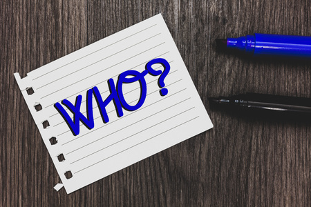 Conceptual hand writing showing Who Question. Business photo text Asking for specific name of someone people personality Marker pens white paper black shadow wood ideas important tipsの写真素材