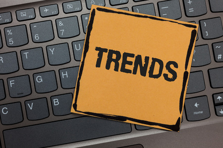 Handwriting text writing Trends. Concept meaning General projected directions of something according to time Black laptop keyboard art paper computer notebook netbook keypad keyの写真素材
