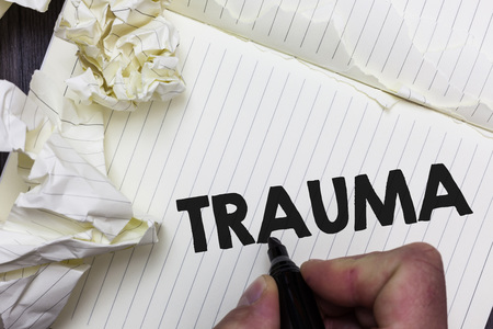 Conceptual hand writing showing Trauma. Business photo showcasing Disturbing physical and emotional injuries shock experience Paper object notepad crumpled papers ideas several triesの写真素材