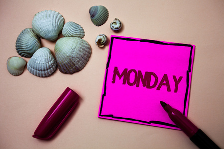 Text sign showing Monday. Conceptual photo First day of the week Back to work Weekend is over Wakeup Early Ink marker open cap small shells handwrittern notes artwork paper sheetの写真素材
